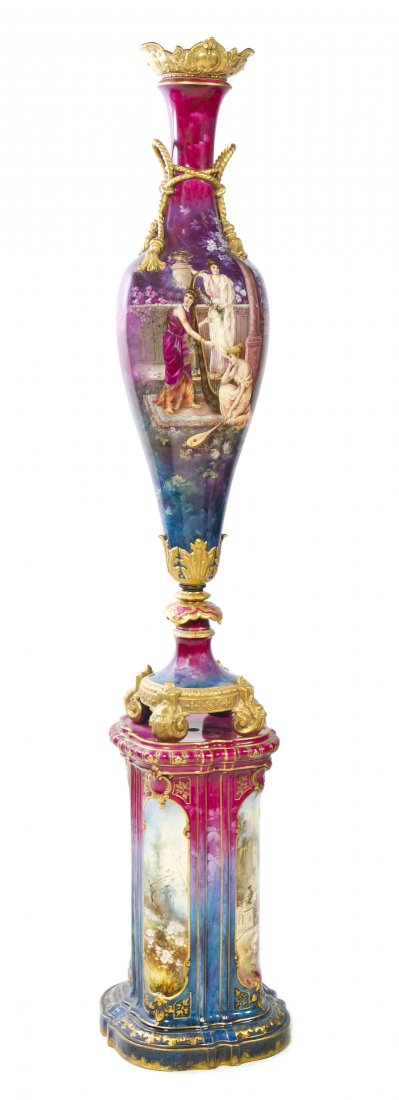 A Royal Bonn Porcelain and Parcel Gilt Vase on Stand,: A Royal Bonn Porcelain and Parcel Gilt Vase on Stand, of slender baluster form with applied rope form handles, decorated with classical maidens and signed indistinctly, raised on a conforming pedestal