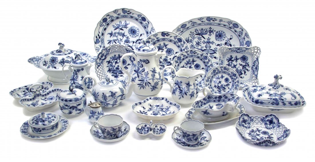 An Assembled Meissen Porcelain Partial Dinner Service: An Assembled Meissen Porcelain Partial Dinner Service for Twelve, in the Blue Onion pattern, comprising dinner plates, luncheon plates, salad plates, bread plates, bowls, 2 sauce boats, 3 dishes, a co