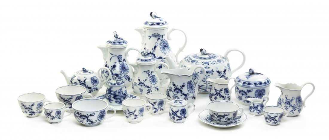 An Assembled Meissen Porcelain Tea and Coffee Service,: An Assembled Meissen Porcelain Tea and Coffee Service, in the Blue Onion pattern, comprising teacups, creamers, sugars, honeys, cups and saucers, each having crossed swords mark in underglaze blue; 11