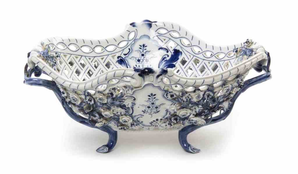 A Meissen Porcelain Center Bowl, Width 17 3/8 inches.: A Meissen Porcelain Center Bowl, of oval handled form with reticulated sides, having blue onion decoration throughout, incised G155, with crossed swords mark in underglaze blue. Width 17 3/8 inches. P