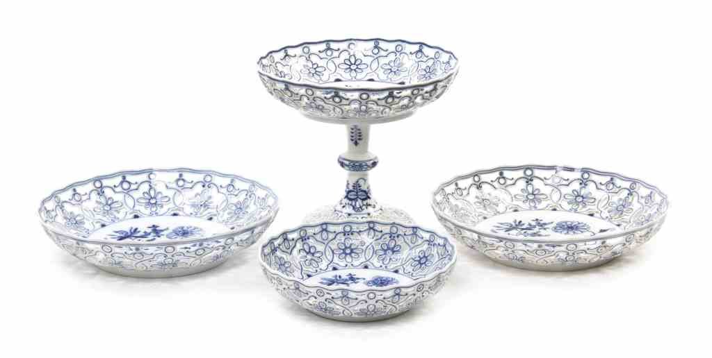 Three Meissen Porcelain Reticulated Table Articles,: Three Meissen Porcelain Reticulated Table Articles, comprising a compote and two bowls, each in the Blue Onion pattern and having crossed swords mark in underglaze, together with an associated example