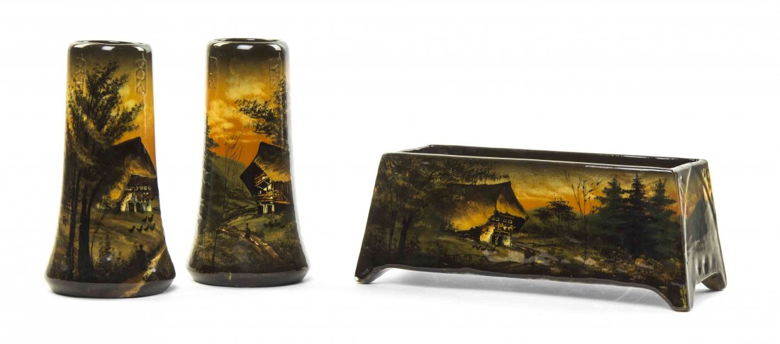 An English Pottery Garniture, Width of jardiniere 9: An English Pottery Garniture, comprising a rectangular jardiniere and two vases, each decorated with a landscape scene. Width of jardiniere 9 inches. Property from the Estate of Grayce Haning, East Pe