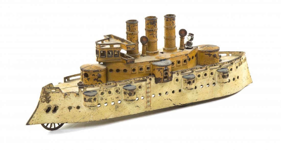 An American Cast Iron Model of the Battleship New York,: An American Cast Iron Model of the Battleship New York, with three stacks and multiple turrets, having yellow paint decoration throughout. Length overall 19 inches.