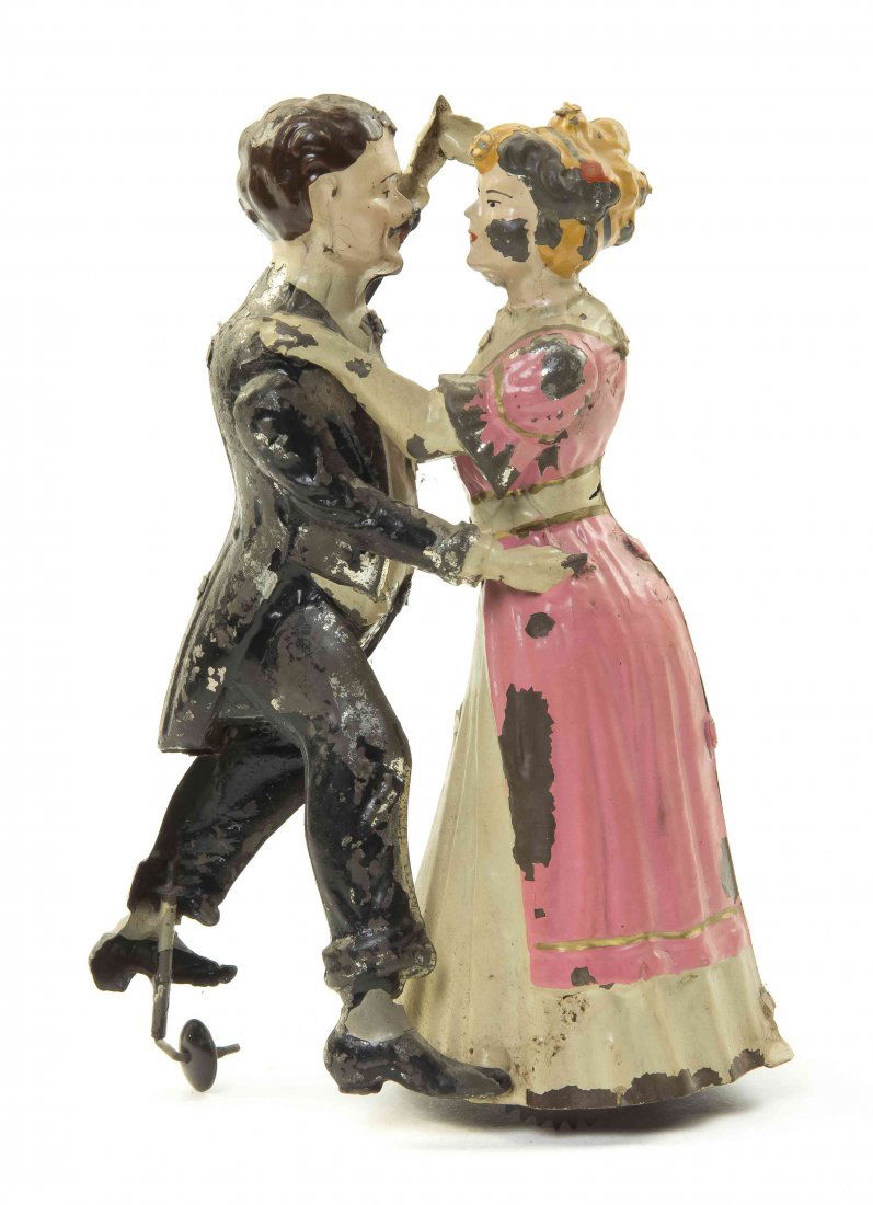 A Bavarian Painted Tin Toy, Gunthermann, Height 7 3/4: A Bavarian Painted Tin Toy, Gunthermann, Tango Dancers, depicting a couple dancing the tango with allover polychrome paint decoration. Height 7 3/4 inches.