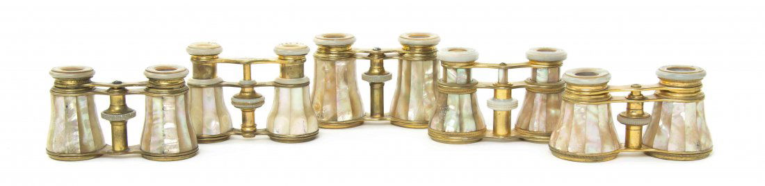 Five Pairs of Mother-of-Pearl Veneered Opera Glasses,: Five Pairs of Mother-of-Pearl Veneered Opera Glasses, two by Lemaire, one retailed by Tiffany & Co., each having faceted veneers with a brass frame. Width of widest 4 1/4 inches. Property from the Est