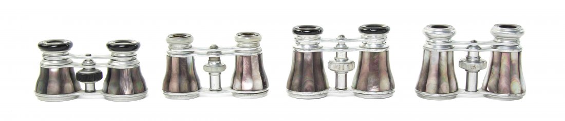 Four Pairs of French Mother-of-Pearl Veneered Opera: Four Pairs of French Mother-of-Pearl Veneered Opera Glasses, one by Colmont, each having mother-of-pearl inset eyepieces, with faceted grey veneers, set in an aluminum frame. Width of widest 4 1/8 inc