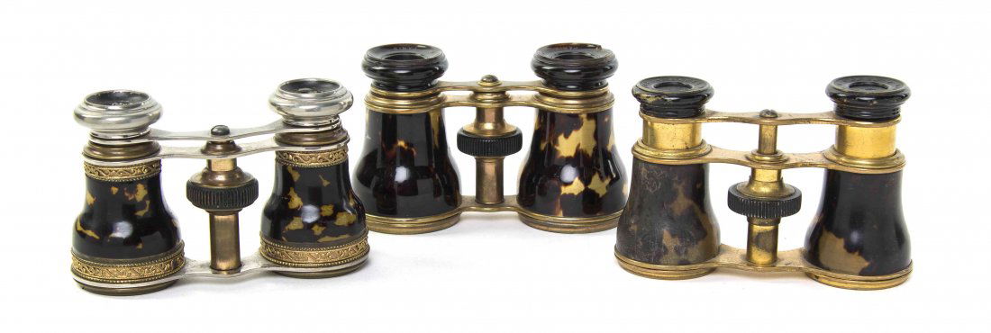 Three Pairs of French Tortoise Shell or Faux Tortoise: Three Pairs of French Tortoise Shell or Faux Tortoise Shell Veneered Opera Glasses, two by Lemaire, two having brass frames, the other steel. Width of widest 4 inches. Property from the Estate of Mr.