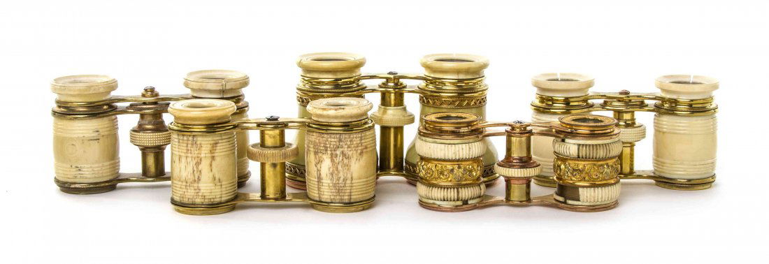 Five Pairs of Ivory or Bone Veneered Opera Glasses,: Five Pairs of Ivory or Bone Veneered Opera Glasses, three with barrel form cylinders and turned ring decoration, one with barrel form cylinders with a foliate gilt metal band. Width of widest 4 3/8 in