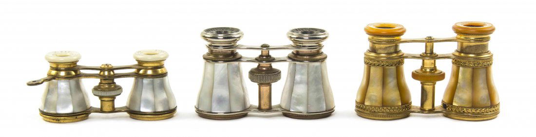 Three Pairs of French Mother-of-Pearl Veneered Opera: Three Pairs of French Mother-of-Pearl Veneered Opera Glasses, comprising one by Lemaire and one by Marchand, two with gilt metal frames, one chromed. Width of widest 4 1/8 inches. Property from the Es
