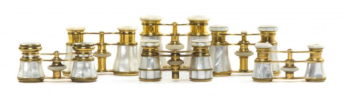 Six Pairs of of French Mother-of-Pearl Veneered Opera: Six Pairs of of French Mother-of-Pearl Veneered Opera Glasses, two by Lemaire, one by Iris, each having faceted veneers with a brass frame. Width of widest 4 inches. Property from the Estate of Mr. Ma