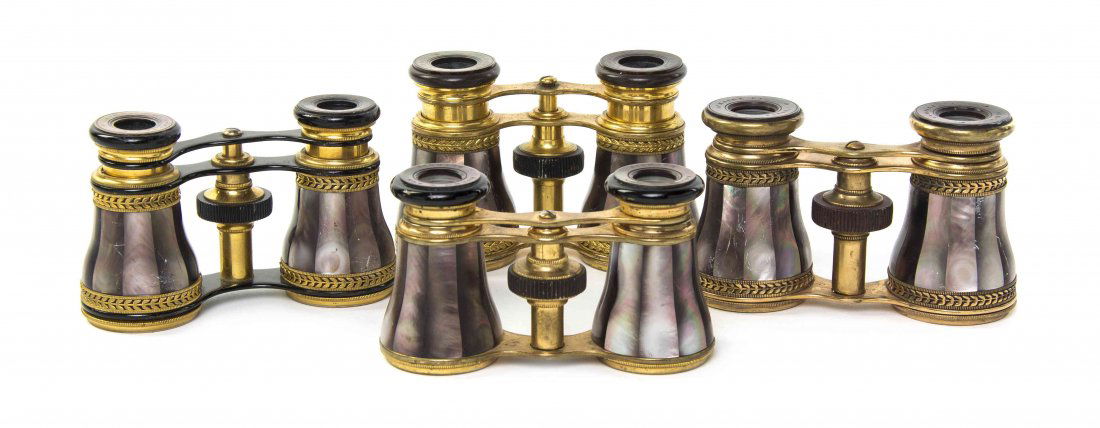 Four Mother-of-Pearl Veneered Opera Glasses, Width of: Four Mother-of-Pearl Veneered Opera Glasses, three by Lemaire, each having brown faceted veneers and set on a brass frame. Width of widest 4 1/8 inches. Property from the Estate of Mr. Mark Fritz, Wes