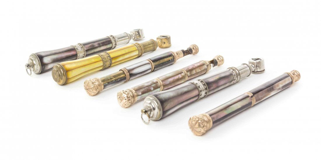 Six French Mother-of-Pearl Veneered Opera Glass: Six French Mother-of-Pearl Veneered Opera Glass Handles, each of cylindrical form, four with gold tone mounts, two with silvered metal mounts. Length of longest 5 7/8 inches. Property from the Estate