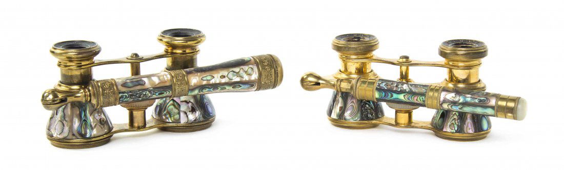 Two Pairs of French Abalone Veneered Opera Glasses,: Two Pairs of French Abalone Veneered Opera Glasses, Iris, Paris, each having faceted veneers and a swing handle with mother-of-pearl focal wheel and set in a brass frame. Width of wider 3 7/8 inches.