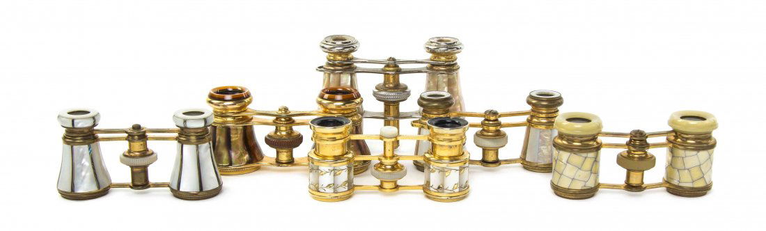 Six Pairs of French Mother-of-Pearl Veneered Opera: Six Pairs of French Mother-of-Pearl Veneered Opera Glasses, comprising two with barrel form cylinders, five with brass frames and one with a steel frame, each in various types of cases. Width of wides