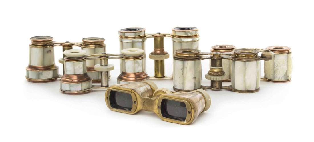 Six Pairs of French Mother-of-Pearl Veneered Opera: Six Pairs of French Mother-of-Pearl Veneered Opera Glasses, comprising three with barrel form cylinders, two with stepped cylinders and one triangular, each having a brass frame. Width of widest 3 3/4