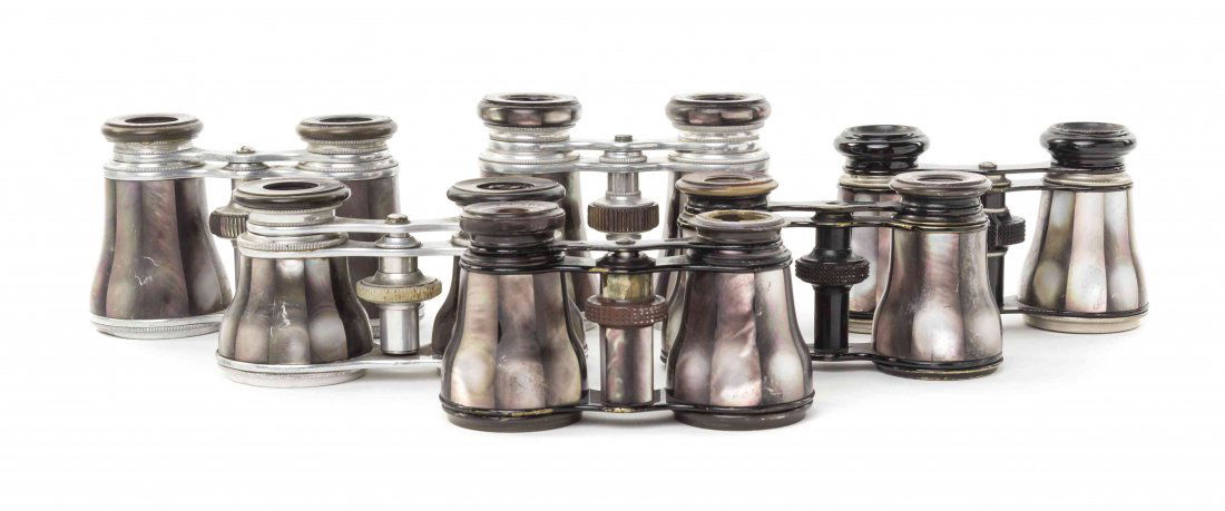 Six Pairs of French Mother-of-Pearl Veneered Opera: Six Pairs of French Mother-of-Pearl Veneered Opera Glasses, including two by Lemaire and others, each with a faceted veneer, three with aluminum frames, three with ebonized frames. Width of widest 4 1