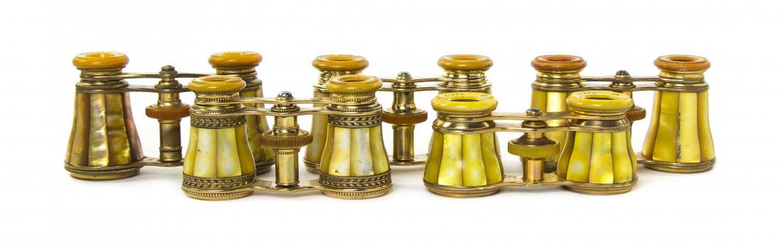 Five Pairs of French Mother-of-Pearl Veneered Opera: Five Pairs of French Mother-of-Pearl Veneered Opera Glasses, three by Lemaire and two by Audemair, each having yellow faceted veneers with a brass frame. Width of widest 3 7/8 inches. Property from th