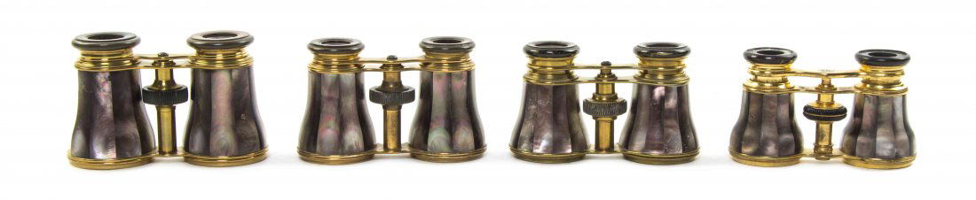 Four Pairs of Mother-of-Pearl Veneered Opera Glasses,: Four Pairs of Mother-of-Pearl Veneered Opera Glasses, one by Lemaire, one by Le Fils, each having faceted grey veneers with a brass frame. Width of widest 4 3/8 inches. Property from the Estate of Mr.