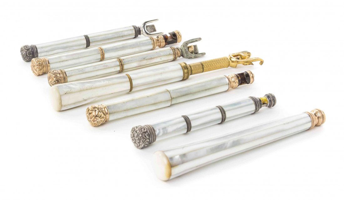 Seven French Mother-of-Pearl Veneered Opera Glass: Seven French Mother-of-Pearl Veneered Opera Glass Handles, each of cylindrical form, three with gold tone mounts, two with silvered metal mounts and two of mother-of-pearl ends. Length of longest 7 5/