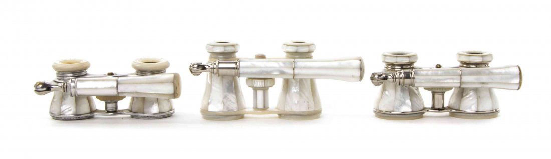 Three Pairs of French Mother-of-Pearl Veneered Opera: Three Pairs of French Mother-of-Pearl Veneered Opera Glasses, comprising two examples by Lemaire and one by Colmont, each having faceted veneers and swing handle, with mother-of-pearl eyepieces and fo