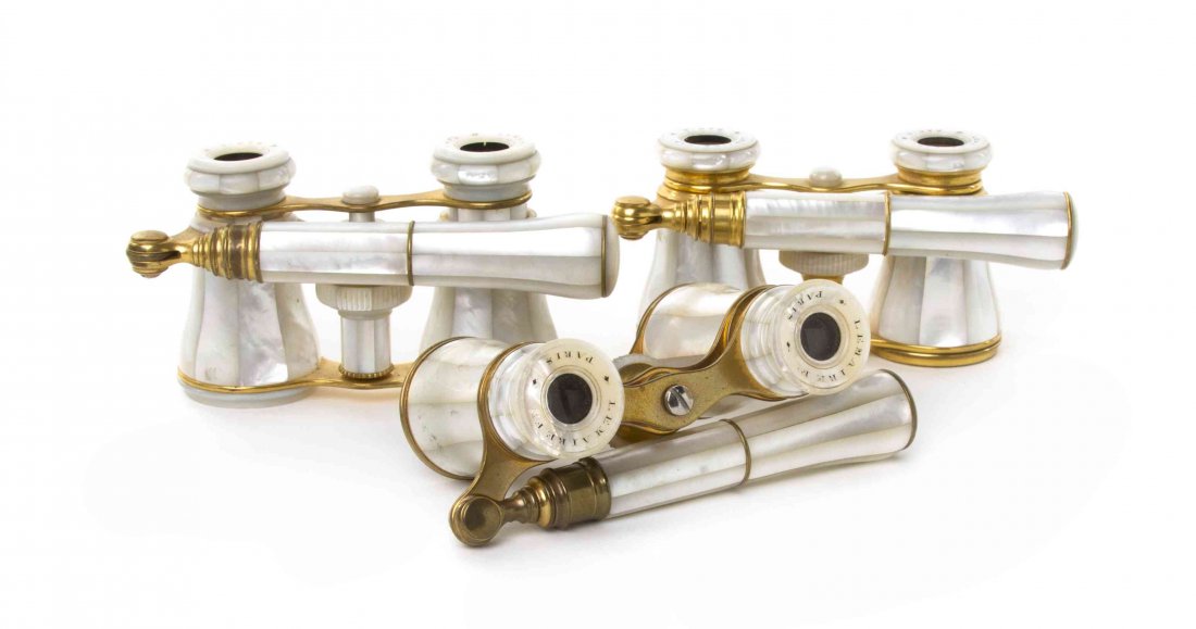 Three Pairs of French Mother-of-Pearl Veneered Opera: Three Pairs of French Mother-of-Pearl Veneered Opera Glasses, Lemaire, each having faceted veneers and swing handle with mother-of-pearl eyepieces and focal wheel, set with a brass frame. Width of wid
