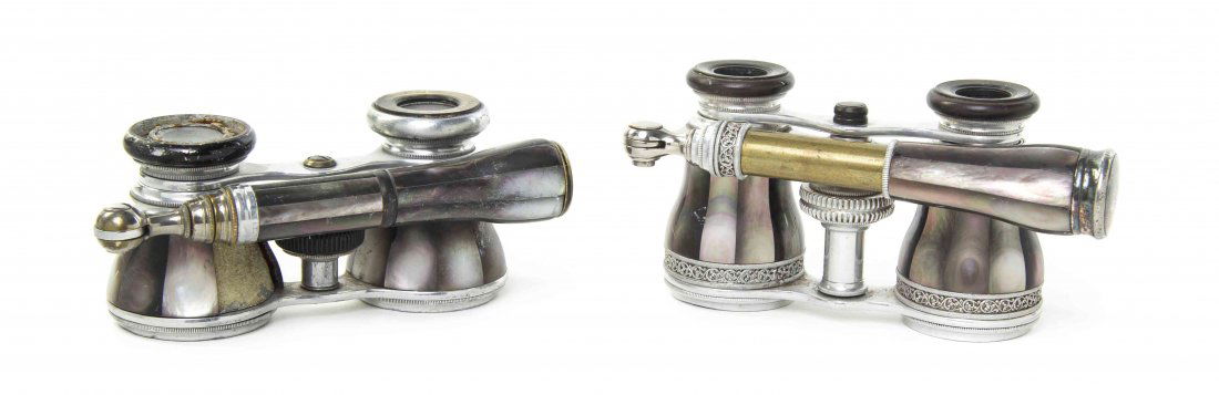 Two Pairs of French Mother-of-Pearl Veneered Opera: Two Pairs of French Mother-of-Pearl Veneered Opera Glasses, each having faceted veneers and mother-of-pearl inlaid eyepieces and handle, with a steel frame. Width of wider 4 inches. Property from the