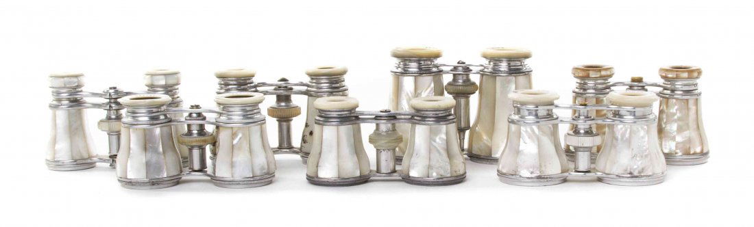 Seven Pairs of French Mother-of-Pearl Veneered Opera: Seven Pairs of French Mother-of-Pearl Veneered Opera Glasses, comprising three by Lemaire, each having faceted veneers with mother-of-pearl eyepieces and focal wheel, one with an applied silver monogr