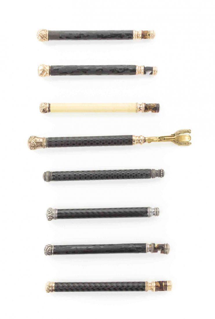Eight French Composite Veneered Opera Glass Holders,: Eight French Composite Veneered Opera Glass Holders, each of cylindrical form, five with gold tone mounts, three with silvered metal mounts. Length of longest 7 3/4 inches. Property from the Estate of