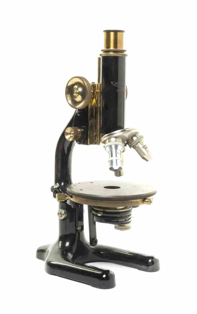 An Austrian Enameled Iron and Brass Microscope,: An Austrian Enameled Iron and Brass Microscope, Reichert, Vienna, serial number 104073. Height 14 inches (extended). Property from the Estate of Roy Francis Daleo, Chicago, Illinois