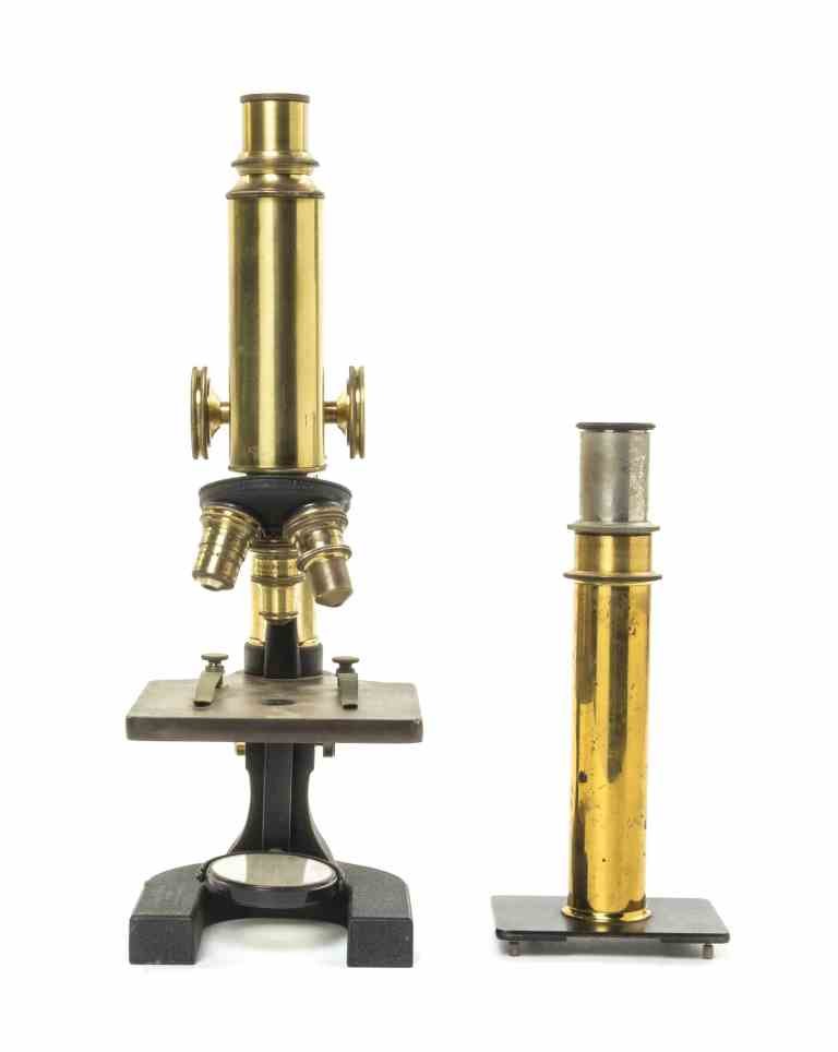 An American Iron and Brass Microscope, Bausch & Lomb,: An American Iron and Brass Microscope, Bausch & Lomb, Rochester, New York, early 20th century, together with a tubular form example. Height of first 13 inches (extended). Property from the Estate of R