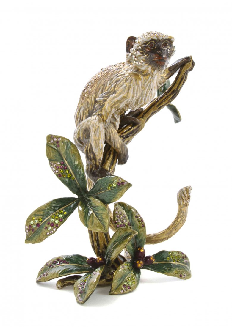 A Jay Strongwater Animalier Figure, Height 7 1/4: A Jay Strongwater Animalier Figure, titled Kamali, from the Jungle Collection, depicting a monkey on a naturalistic branch, having enamel and crystal decoration with original fitted box and sleeve. He