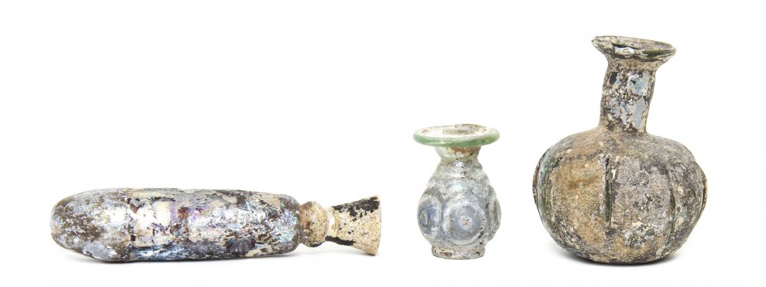 Three Roman Style Glass Articles, Height of tallest 5: Three Roman Style Glass Articles, each of various form and size, comprising a flask, a vase and a bottle. Height of tallest 5 1/8 inches. Provenance: Ancient Creations, Las Vegas, Nevada
