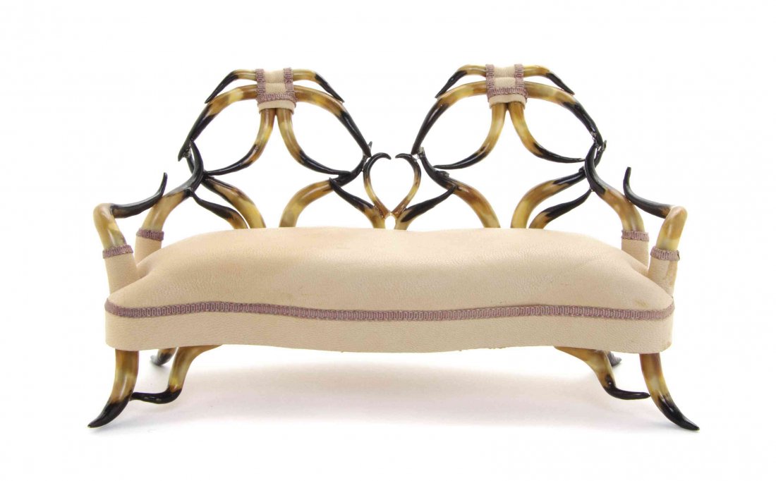 A Late Victorian Style Horn Settee, Susanne Russo,: A Late Victorian Style Horn Settee, Susanne Russo, having a leather upholstered seat, the base signed Susanne Russo 1990. Width 6 inches. The Adell Venus Collection of Miniatures Property from the Est