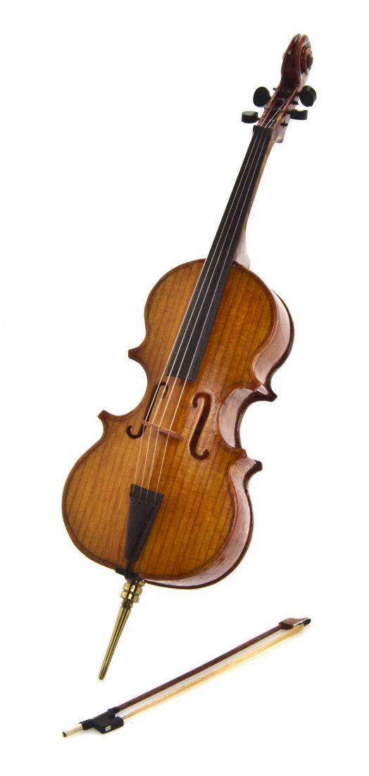 A Scale Model of a Cello, W. Foster Tracy, Length 5 1/4: A Scale Model of a Cello, W. Foster Tracy, made of birds-eye maple, spruce and ebony, the bow made with pernambuco wood, 14K gold end and sterling silver plug, signed to interior of instrument, set in