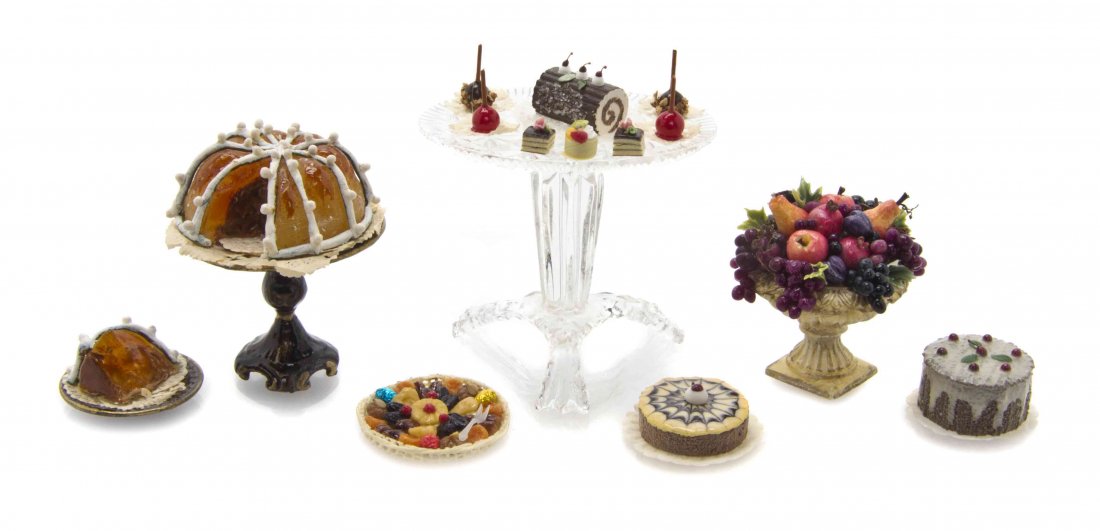 A Collection of Confectionary and Bakery Related: A Collection of Confectionary and Bakery Related Articles, comprising a compote of fruit, bearing a sticker inscribed Hope Elliott 2003, cake, two cheesecakes, ice cream log, vintage jello mold on sta