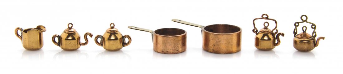 A Collection of Copper Exonumia Charms, Width of widest: A Collection of Copper Exonumia Charms, comprising five made from a U.S. wheat cent, including three tea kettles, two of which have swing handles, a covered sugar bowl and a pitcher, and two British c