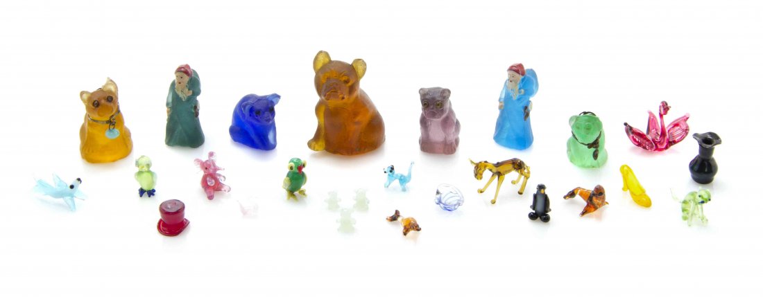 A Collection of Glass Animal Figures, Height of tallest: A Collection of Glass Animal Figures, comprising dogs, bears, monkey, pigs, and others, together with Santa Claus figures, a sphinx, birdcage and a vase; approximately 60 items total. Height of talles