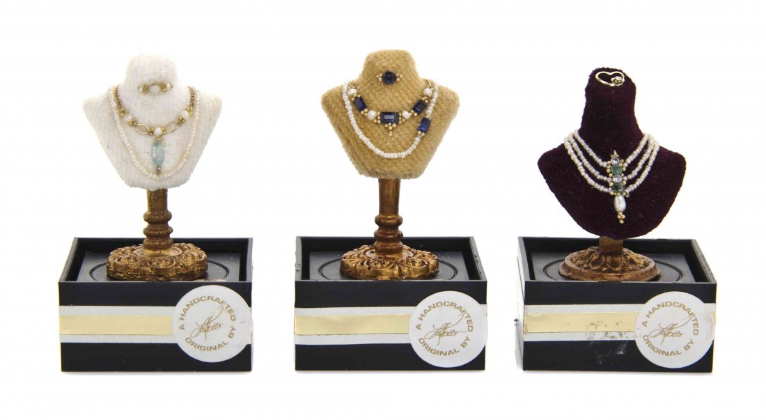 Three Suites of Jewelry on Display Busts, Lori Ann: Three Suites of Jewelry on Display Busts, Lori Ann Potts, each comprising a brooch and necklaces, all three with seed pearls and 14K gold, one set with emeralds, diamonds and Swarovski crystals, anoth
