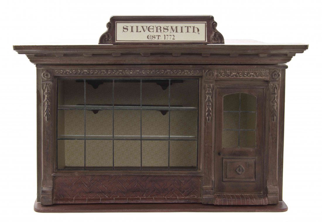 A Painted and Molded Store Display Diorama, Eugene: A Painted and Molded Store Display Diorama, Eugene Kupjack, having a molded cornice with a dentiled frieze, surmounted with a sign reading Silversmith Est. 1772, above the conforming body with a front
