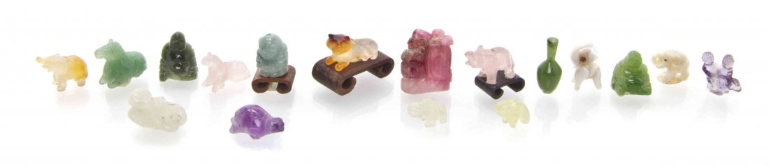 A Group of Seventeen Hardstone and Glass Decorative: A Group of Seventeen Hardstone and Glass Decorative Articles, comprising three figures of Buddha, animals and other examples. Height of tallest 1/2 inches. The Adell Venus Collection of Miniatures Pro