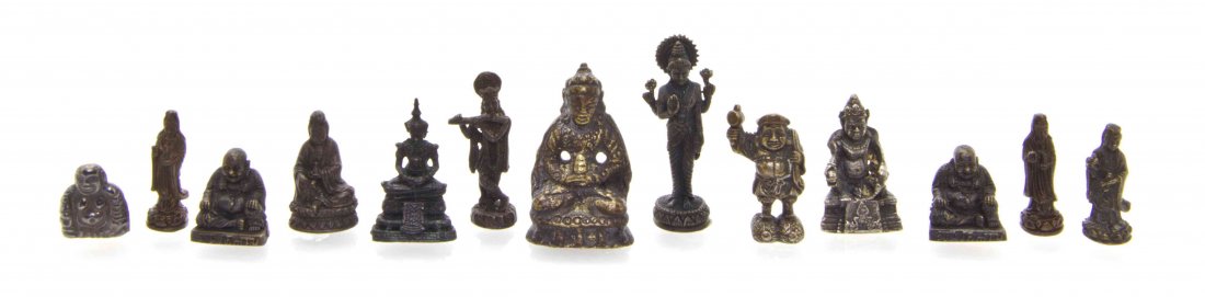 A Group of Thirteen Asian and Southeast Asian Figures: A Group of Thirteen Asian and Southeast Asian Figures of Deities, comprising Krishna, Hotei, Guanyin and others. Height of tallest 1 1/2 inches. The Adell Venus Collection of Miniatures Property from 