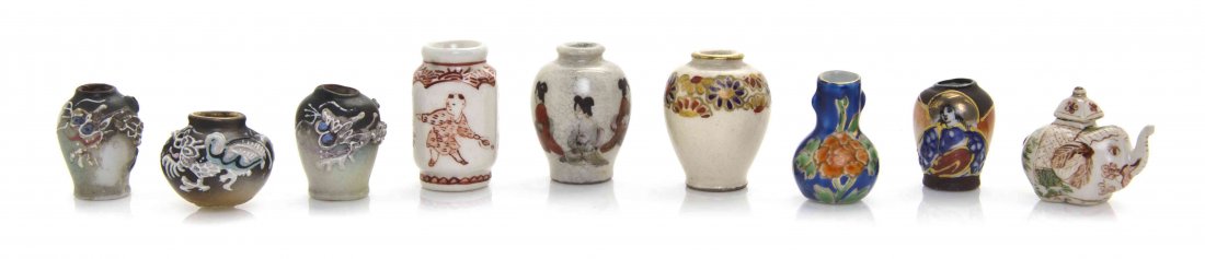 A Group of Nine Japanese Ceramic Articles, Height of: A Group of Nine Japanese Ceramic Articles, comprising eight vases of varying decoration, including moriageware and an elephant-form teapot. Height of tallest 1 1/4 inches. The Adell Venus Collection o