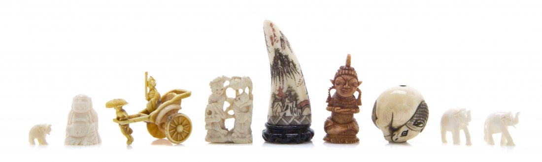 A Group of Nine Carved Ivory Articles, Height of: A Group of Nine Carved Ivory Articles, comprising a horse ojime, polychrome decorated ivory tusk, three figures of elephants, and other examples. Height of tallest 1 5/8 inches. The Adell Venus Collec