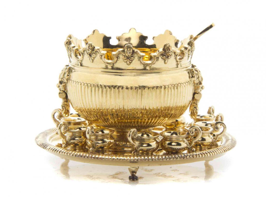 An 18 Karat Gold Punch Set, after English examples,