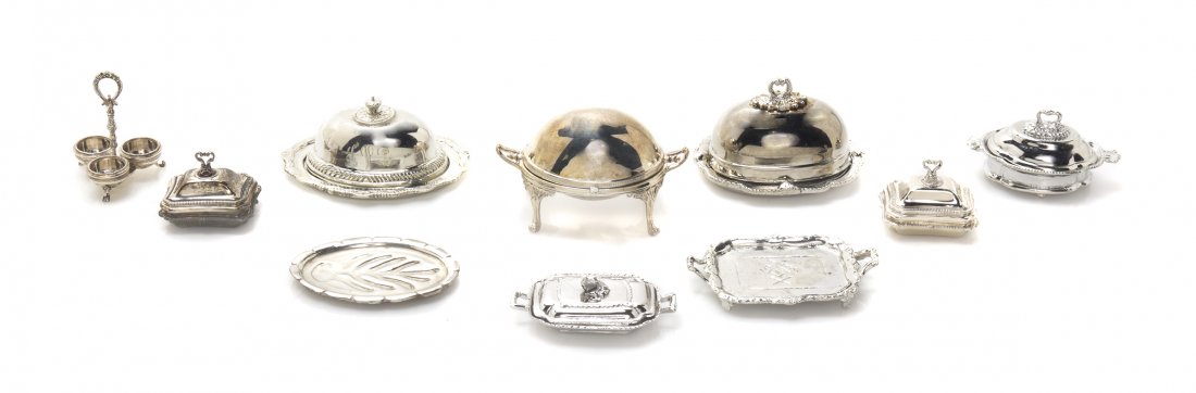A Collection of Silver and Silverplate Articles, Height: A Collection of Silver and Silverplate Articles, comprising a fireplace set including a stand with a shell base, tongs, shovel and a pick, four picture frames, seven animalier stirrup cups by Eugene K