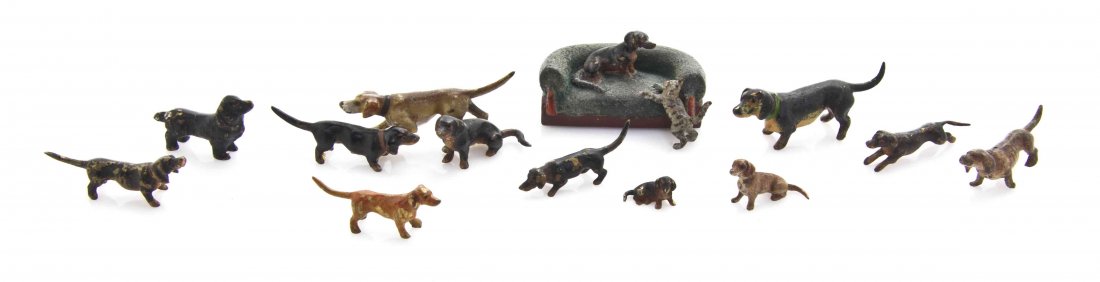 Eleven Austrian Cold Painted Miniature Bronze Animalier: Eleven Austrian Cold Painted Miniature Bronze Animalier Figures and Figural Groups, mainly depicting dachshunds, including one on a settee with a playful kitten. Length of longest 2 inches. The Adell 
