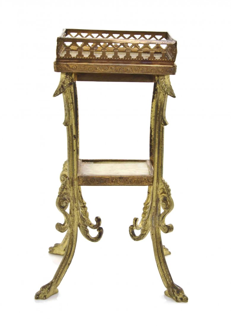 A Continental Gilt Metal and Onyx Inset Occasional: A Continental Gilt Metal and Onyx Inset Occasional Table, having a galleried square top raised on splayed legs with foliate decoration, centered with a medial shelf, terminating in paw feet. Height 6 