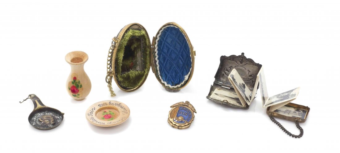 A Collection of World's Fair Articles, Width of widest: A Collection of World's Fair Articles, comprising an egg form thimble holder from the Paris Exposition of 1900, 1939 New York enameled pin, 1933 Chicago vase and plate from Hungary, 1901 Pan American 
