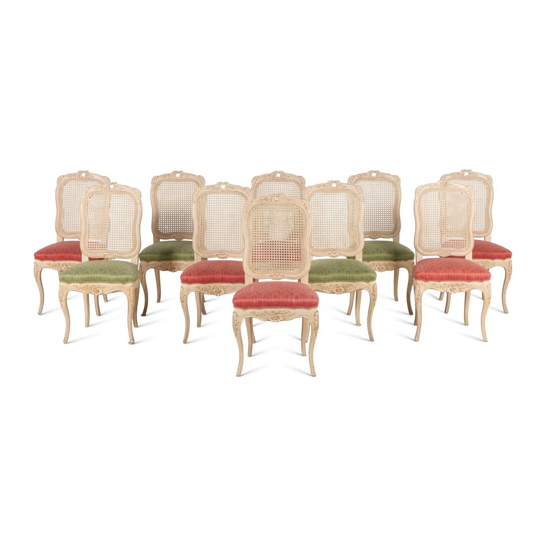 A Set of Ten French Provincial Style White-Painted Dining Chairs: A Set of Ten French Provincial Style White-Painted Dining Chairs 20th Century six examples having green upholstered seats and four with pink upholstered seats. Height 39 x width 19 x depth 18 inches. 