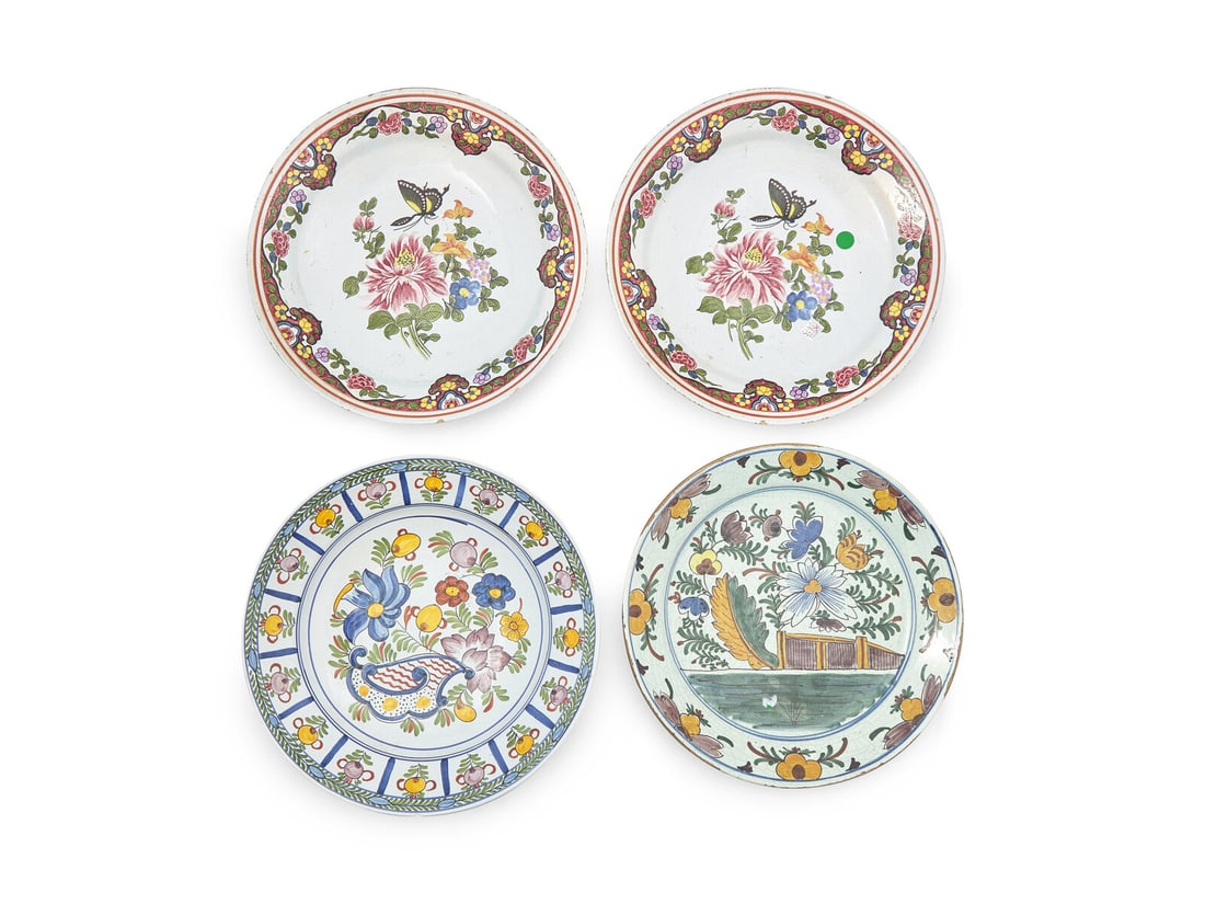 Four Dutch Delft Polychrome Chargers: Four Dutch Delft Polychrome Chargers 18th / 19th Century comprising a pair with butterfly motif, marked in blue underglaze, "MP," to underside, possibly for De Metaale Pot (1670-1775); a charger beari